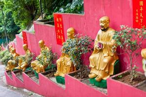 Golden statues in The monastery in Hong Kong photo