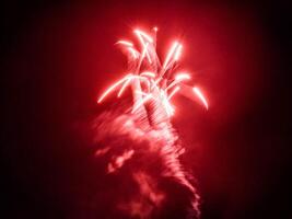 multi-colored fireworks on a black sky background. above city photo