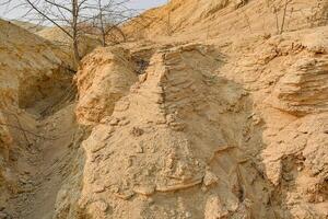 Large mountains of yellow sand. Sand quarry. Quarry sand mining. photo
