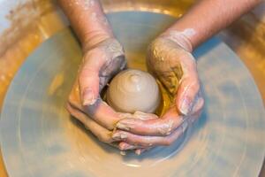Pottering - creating a clay cup in process photo