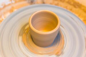 Pottering - creating a clay cup in process photo