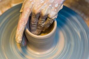 Pottering - creating a clay cup in process photo