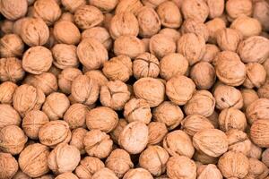Whole walnuts background texture photo
