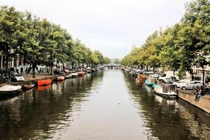 A canal with many boats photo