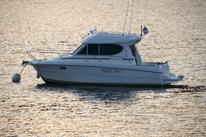 A boat is floating in the water photo