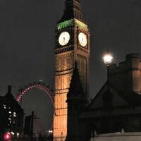 A large clock tower with a clock on it photo