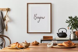 Creative and modern dining room interior design with mock up poster frame, family dining table, black console and retro inspired personal accessories. Template. Autumn vibes. photo