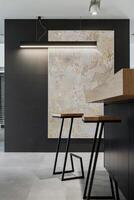 Elegant modern kitchen interior with kitchen island, bar stools and creative wall decoration. Mock up frame. Geometric forms and shapes. Template. photo