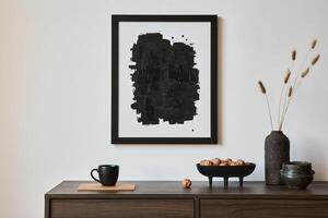 Minimalistic composition of creative living room interior with mock up poster frame and stylish small personal accessories on wooden commode. Copy space. Template photo