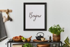 Stylish and cozy kitchen interior composition with mock up poster frame,black console, teapot, plants and retro inspired accessories Template. Autumn vibes photo