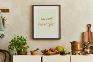 Stylish composition of modern kitchen interior design with mock up poster frames, beige sideboard and retro accessories. Template. Autumn vibes photo