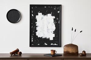 Minimalistic composition of creative living room interior with mock up poster frame and stylish small personal accessories on wooden commode. Copy space Template. photo