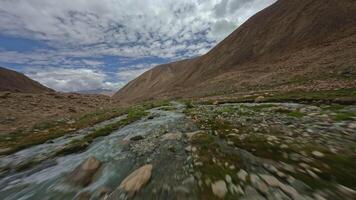 Mountain river in the mountains of India view from FPV drone video