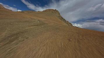 Desert mountain ranges in Tibet view from an FPV drone video