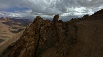 Rocky ridges in the Tibetan Mountains view from an FPV drone video