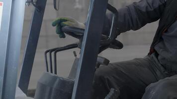 An Operator Skillfully Handling Forklift Controls While Operating in a Warehouse Environment. Clip video