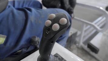 Close up view of Heavy Equipment Joystick Control actively being used during operations. Clip video