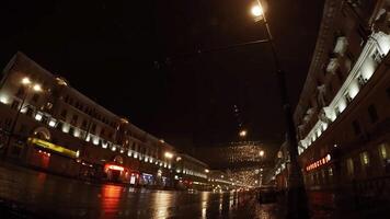 Experiencing Night Rain within an Urban Setting Enhanced by Street Lights Glimmering in the Rain. Stock Clip video
