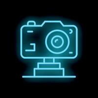 Neon sign representing camera standing on a pedestal on black background vector