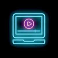 Bright neon icon of laptop showing player with play button vector