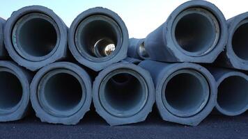 Motion along concrete pipes to install at construction site video