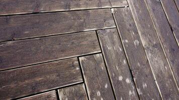 Shabby wooden walkway of grey color with rectangular panels video