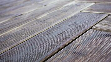 Old worn wooden walkway with narrow long rectangular panels video