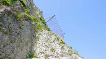 Mountain of rocks with protective wire mesh video