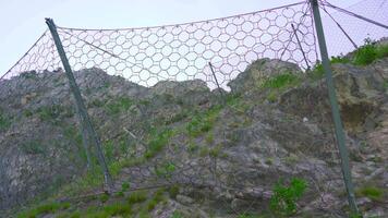 Wire mesh on the rocks of the mountain video
