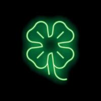 Green neon four leaf clover glowing on black background vector