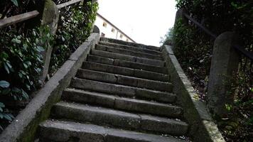 Outdated grey stairs with brown metal rusty handrails video