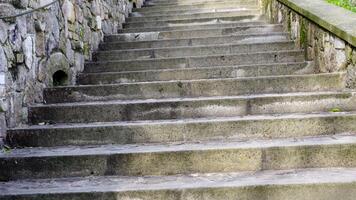 Grey concrete stairs with decorative stone handrails video