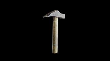 Vintage hammer with wooden handle and metal head on black video