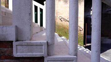 White concrete stairs with large columns as handrails video