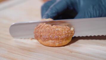 Choux pastry is cut in two with a knife video