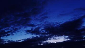 Wonderful stormy clouds float across colorful sky with wind video