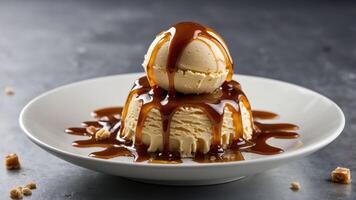 A dessert featuring a scoop of ice cream on a cake drizzled with caramel sauce. photo