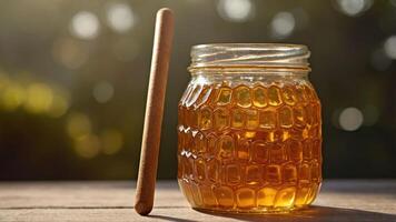 A jar of honey with a wooden dipper, set against a soft, natural background. photo