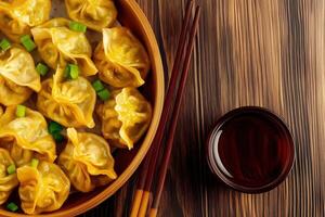 Steamed Golden Dumplings in a Bamboo Basket with Dipping Sauce photo