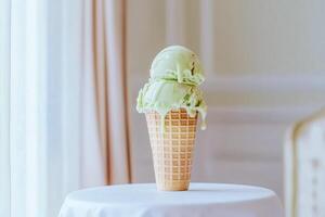 Melting Double Scoop Green Ice Cream Cone on Table photo