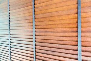 Wooden blinds on a wall photo