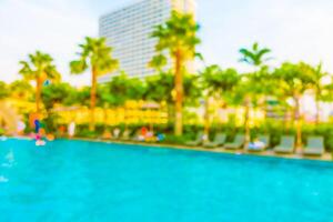 A blurry image of a pool with a building in the background photo