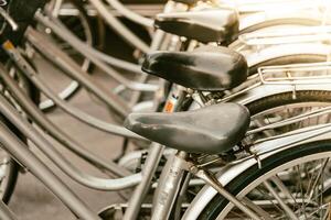 A row of bicycles parked in a row photo