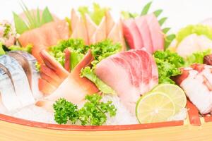 A bowl of sushi with various types of fish photo