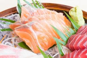A bowl of sushi with different types of fish photo