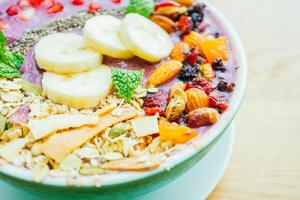 A bowl of fruit and nuts photo