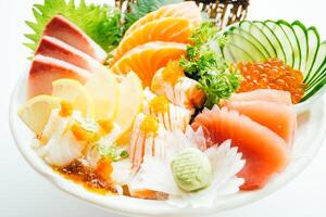 A bowl of sushi with various types of fish photo