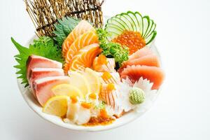 A bowl of sushi with various types of fish photo