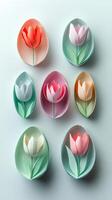 Colorful paper flowers with cut out petals on a light background in an artistic display photo
