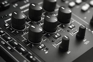 Close up view of audio mixing console with knobs and controls during music production session photo